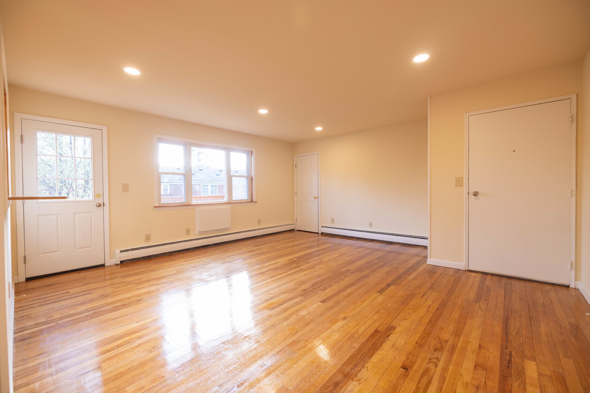 Spacious living room with hardwood floors